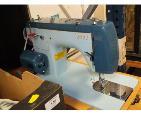 A CASED VINTAGE JONES SEWING MACHINE