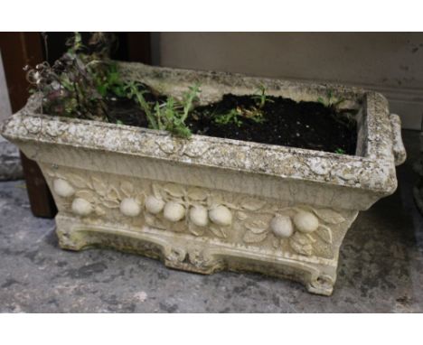 A STONE RECTANGULAR GARDEN PLANTER WITH FRUIT DETAIL