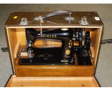 A CASED VINTAGE SINGER SEWING MACHINE