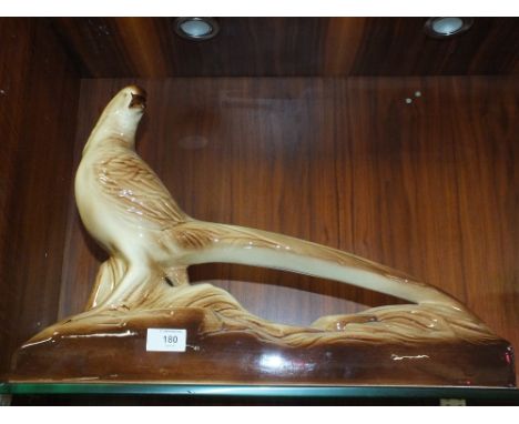 A FRENCH CERAMIC BIRD FIGURE 
