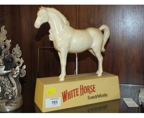 A VINTAGE PLASTIC WHITE HORSE WHISKY ADVERTISING FIGURE