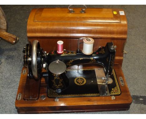 A CASED VINTAGE VESTA SEWING MACHINE