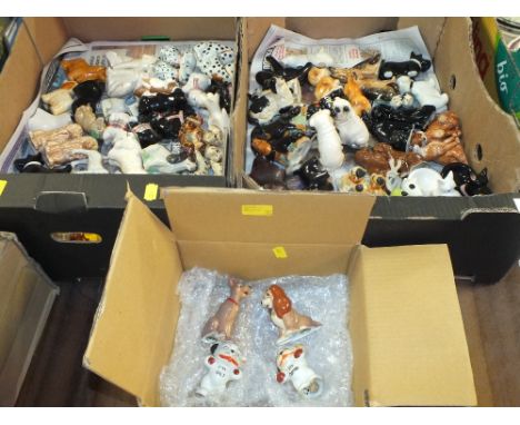 A LARGE QUANTITY OF NOVELTY CERAMIC DOG SHAPED CRUETS TO INCLUDE BONZO DOG &amp;&nbsp;DISNEY EXAMPLES
