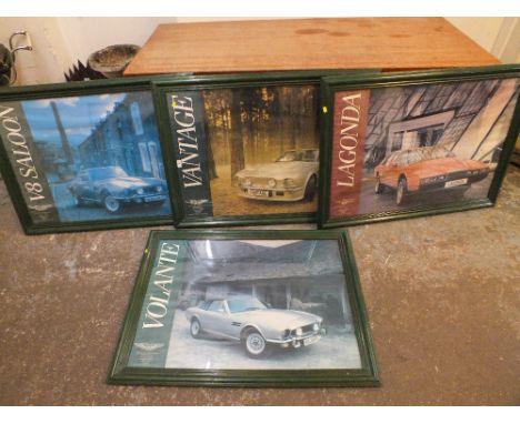 FOUR LARGE FRAMED AND GLAZED VINTAGE ASTON MARTIN CAR ADVERTISING POSTERS A/F