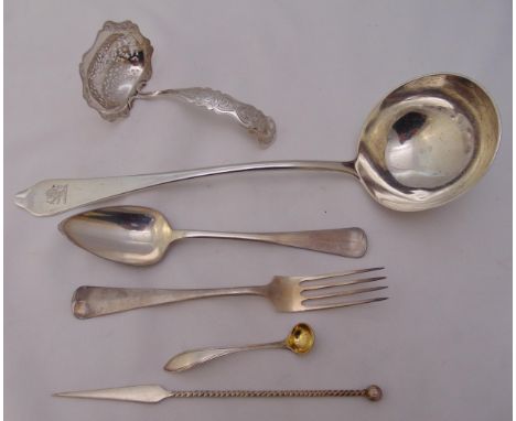 A hallmarked silver soup ladle the trefid terminal engraved with a crest, London 1903, two white metal ladles and a white met