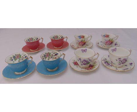 Eight Aynsley teacups and saucers decorated with flowers and leaves (16)