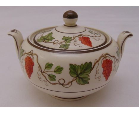 A Wedgwood sugar bowl and cover of compressed cylindrical form with up swept handles and ball finial to raised pull off cover
