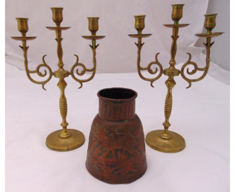 A pair of brass three light candelabra, 34.5cm and a copper conical vase chased with deer and trees, 18cm (h)