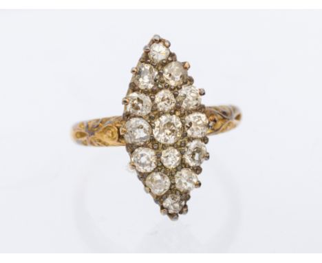 An Edwardian diamond set 18ct gold marquise shaped cluster ring, comprising a claw set marquise mount set with 14 old Europea