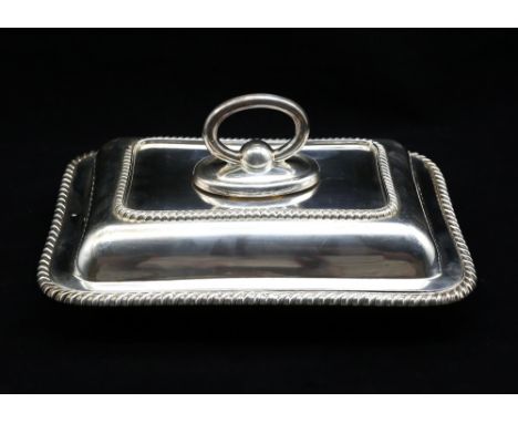 A George V silver entrée dish and cover, with gadrooned rims, hallmarked by Thomas Bradbury & Sons, London, 1911, with Harrod