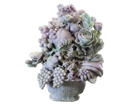 A Chinese large carved lavender jade basket of fruits and flowers, 20th century, centred by a large peach amongst peonies, lo