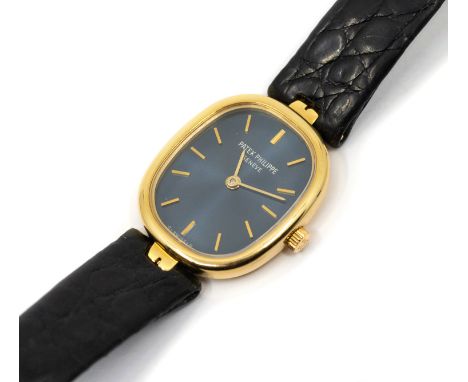 Patek Philippe- a ladies 18ct gold Golden Ellipse wristwatch, comprising an off oval blue signed dial with applied gold baton