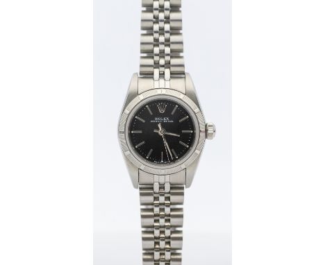 Rolex- a ladies steel cased Oyster Perpetual wristwatch, comprising a signed black dial, with applied steel baton makers with