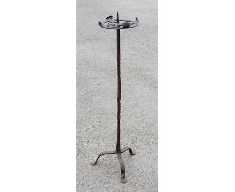 An 18th / 19th century tall wrought iron candlestick, having circular pierced top with Celtic style knot design, central pric