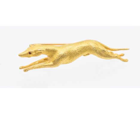 A 20th century gold brooch, realistically modelled as a racing greyhound, cabochon ruby set eyes, length approx 55mm, unmarke