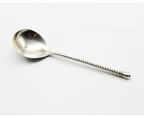 An early 20th century Russian silver spoon, with twisted stem leading to coronet finial, back of bowl with niello foliate des