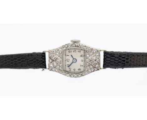 An Art Deco diamond set cocktail wristwatch, comprising a cushion shaped dial with Arabic numbers, chapter ring with blue ste