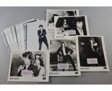 Mick Jagger, The Rolling Stones, 15 professionally taken photographs of Mick Jagger, 4 black & white with stamps & the other 