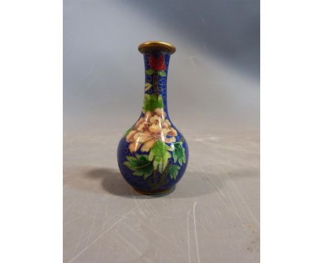 A Chinese Cloisonné enamel vase with peony and butterfly motifs and a cloud form background. H10cm. 