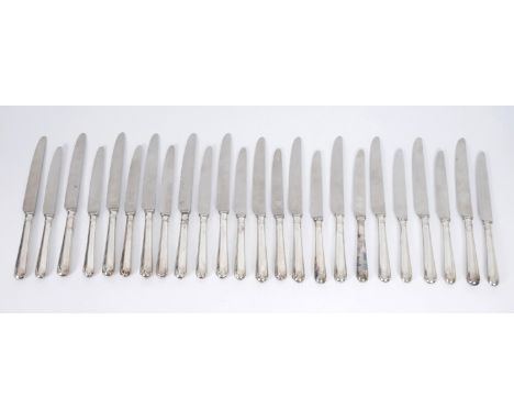 Silver handled dinner knives. A set of 24 silver-handled knives, comprising 12 table-knives and 12 side-knives, Sheffield, 19