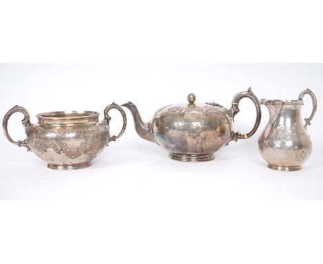 Victorian silver tea service. A Victorian silver three-piece tea service, of squat melon shape, the body engraved with scroll