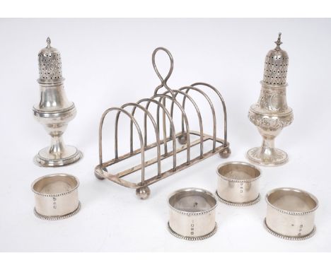 Georgian and Victorian silver table ware. A Victorian silver seven-bar toast rack, Birmingham, 1878; a set of four Victorian 