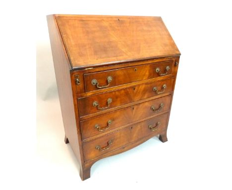 Mahogany bureau of Georgian style, sloping fall front enclosing small drawers, pigeonholes and a cupboard, four long graduate