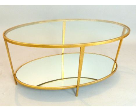 Oval lounge table, glass top over mirror lower shelf, gilt finish 100cm L. 