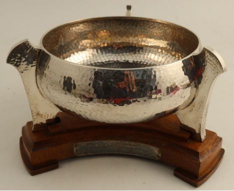 A silver Arts and Crafts style circular bowl, with three lug feet and hammered finish, Chester 1912, weight 18oz, together wi