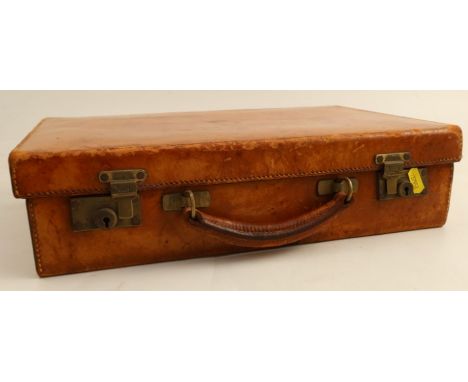 A vintage brown leather covered suitcase, with Chubb locks, 16ins x 10.5ins x 4ins