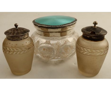 A glass dressing table power puff jar, with hallmarked sliver and enamel cover, together with a pair of frosted glass condime