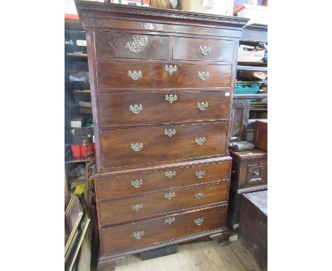 A late Georgian mahogany chest on chest, the top section fitted two short drawers over three graduated long drawers, over thr