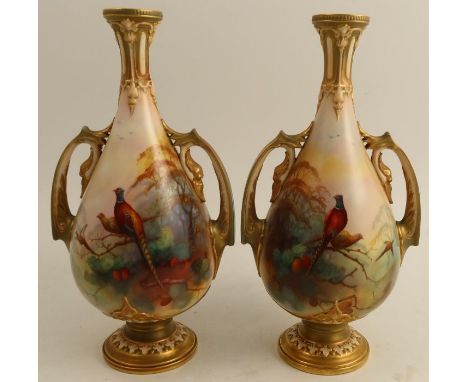 A pair of Royal Worcester vases, decorated with pheasants roosting in a tree by Lewis, with gilt handles, neck and pedestal f