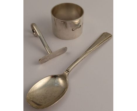 A hallmarked silver napkin ring, together with a silver babies push and spoon, weight 3oz