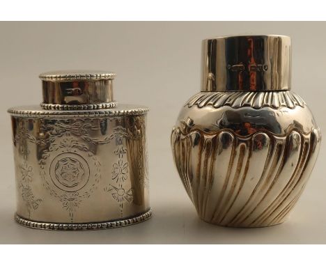 Two hallmarked silver tea caddies, one of oval form with engraved decoration, the other bulbous with gadrooned decoration, bo