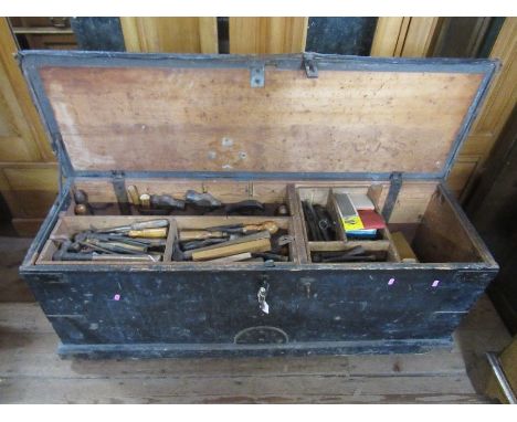 A large tool chest and contents, including assorted planes, woodworking tools etc.