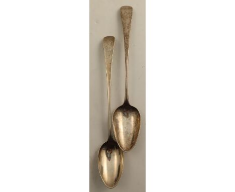 Two Georgian silver basting spoons, one engraved with a crest the other initials, London 1787 and 1800, weight 6oz, length 12