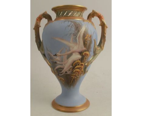 A Royal Worcester vase, decorated with flying swans to a powder blue ground by C H C Baldwyn, having open handles, circa 1927