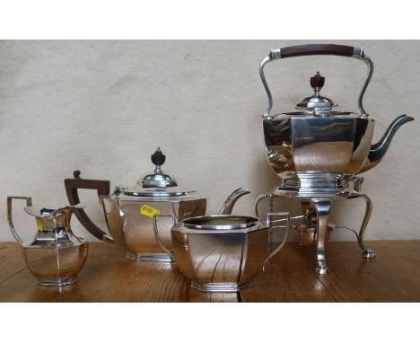 A silver four piece tea set, comprising spirit kettle on stand with burner, a tea pot, milk jug and sugar bowl, Sheffield 191