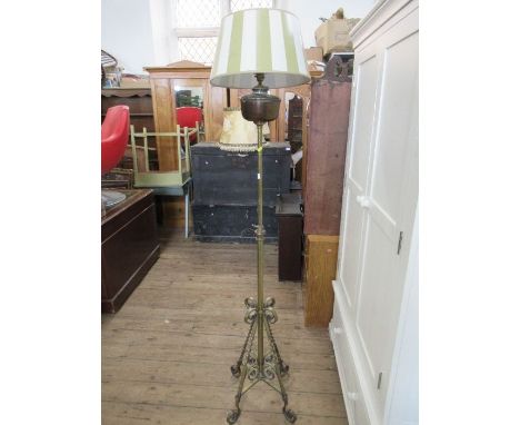 An ornate gilt standard lamp