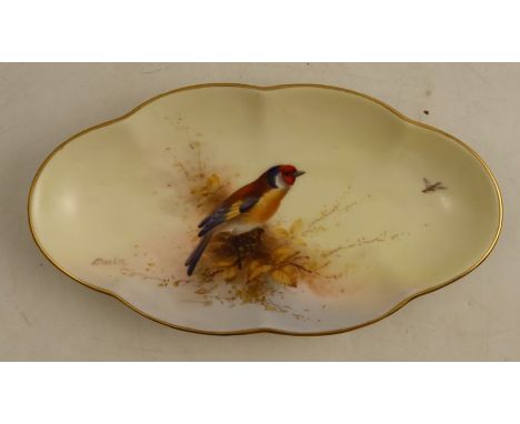 A Royal Worcester shaped oval dish, decorated with a Goldfinch and foliage by E Barker, maximum diameter 9ins