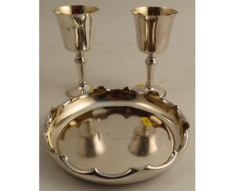 A pair of silver goblets, Birmingham 1972, weight 10oz, together with a circular silver plated dish, with shaped edge