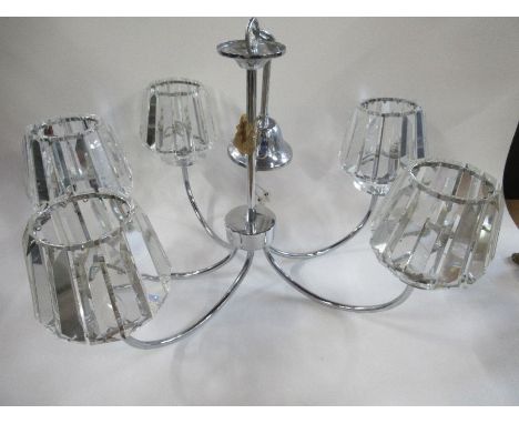 A pair of light fittings and an art deco style lamp