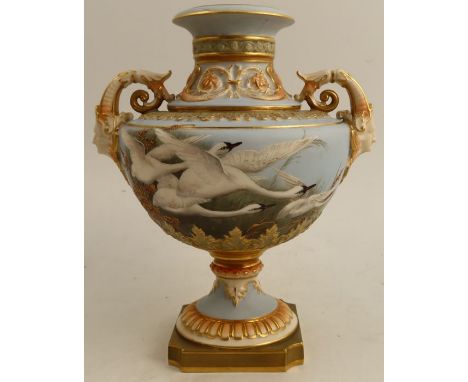 A Royal Worcester pedestal vase, the front decorated with swans in flight to a powder blue ground by Raymond Rea, the back wi