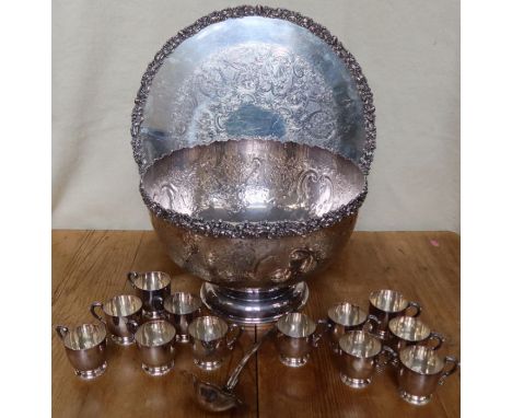 A Barker Ellis silver plated punch bowl and circular tray, the embossed edge decorated with scrolls and flowers, the body eng