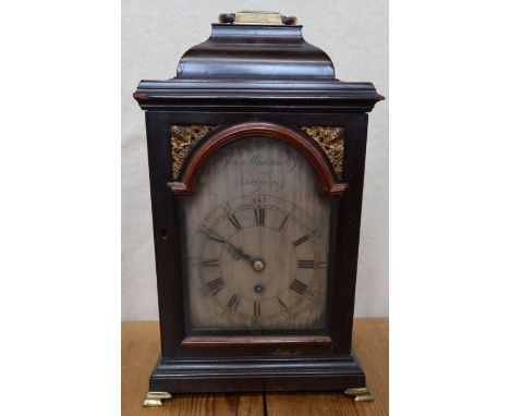 A Georgian mahogany cased bracket clock, the silvered arched dial inscribed John Wightwick, London, height including handle 1