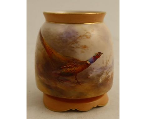 A Royal Worcester vase, with blush ivory neck and foot, the body decorated to the front with a pheasant in landscape by Jas S