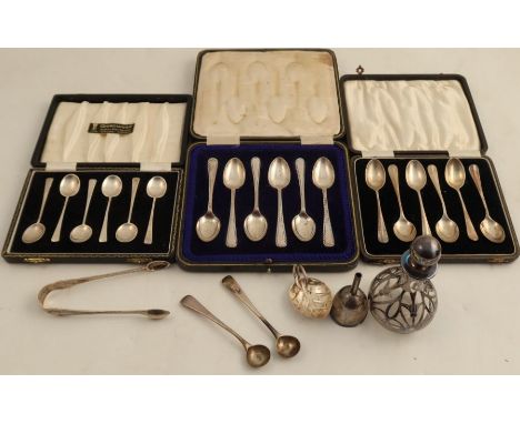 A cased set of six hallmarked silver tea spoons, together with two other sets of hallmarked silver spoons, and various other 