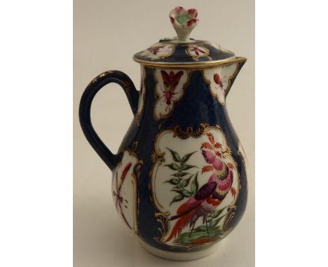 An 18th century Worcester covered sparrow beak jug, the scale blue ground decorated with reserve panels of insects and fabulo