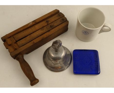 A WW2 RAF W Adams pint mug together with a WW2 A R P gas attack warning wooden rattle, an RAF Benevolent Fund aluminium bell 